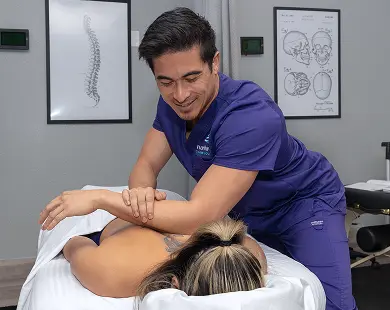 Las Vegas Massage Therapy School student at Northwest Career College practicing hands-on massage training