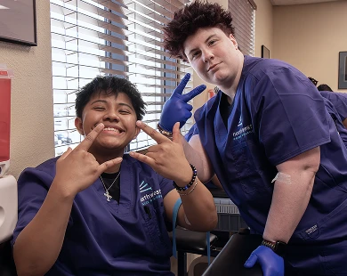 Phlebotomist training students in Las Vegas at Northwest Career College after hands-on blood draw practice