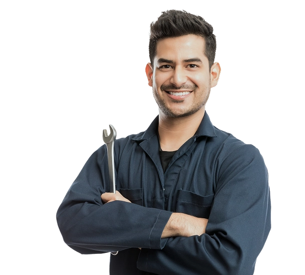 Smiling male automotive technician in dark work uniform with arms crossed holding a wrench against a plain white background.